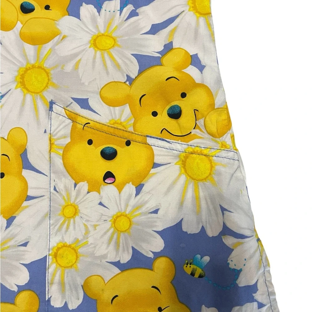 Disney Blue and Yellow Floral Print Adult Woman’s Scrub.
Size S - Picture 4 of 13